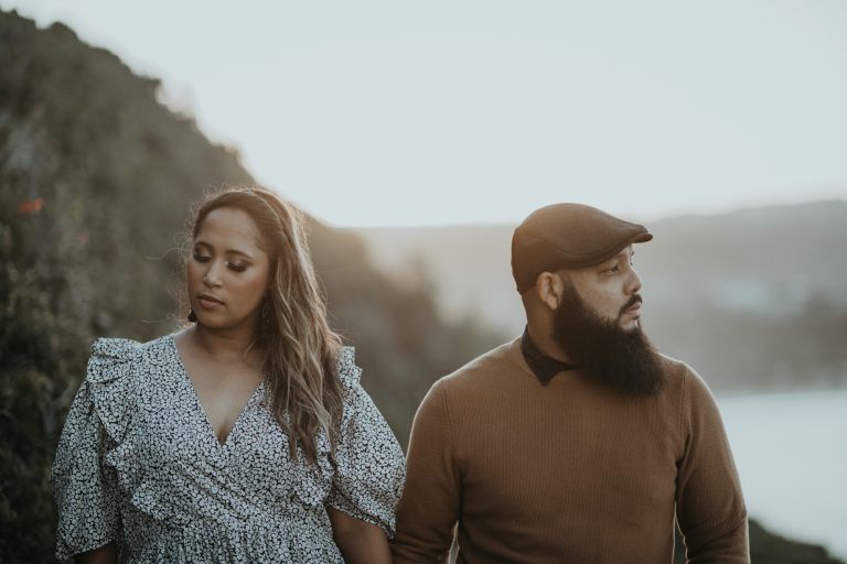 Couple walking together along the Robberg Nature Reserve coastline
