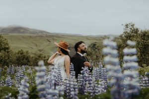 Home Updated 32 wedding and elopement photographer sara and ryan dancing beneath skógafoss during their iceland elopement.